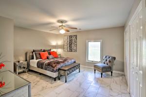 a bedroom with a bed and a ceiling fan at Quiet Memphis Home on 20 Acres 10 Mi to Downtown! in Memphis
