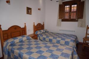Cama o camas de una habitación en Casa Rural Os Arregueses