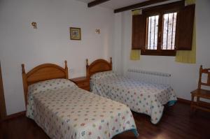 Cama o camas de una habitación en Casa Rural Os Arregueses