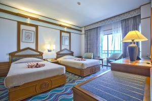 Postel nebo postele na pokoji v ubytování Asia Cha-am Hotel