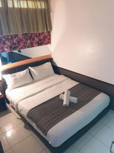 Postel nebo postele na pokoji v ubytování Langit Langi Hotel @ KLIA/KLIA2