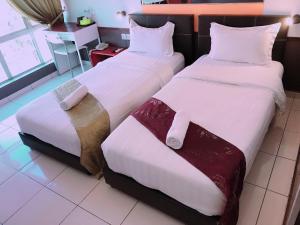 Postel nebo postele na pokoji v ubytování Langit Langi Hotel @ KLIA/KLIA2