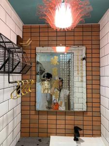 a mirror on a wall in a room at Wontonmeen in Hong Kong
