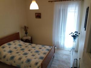 Postel nebo postele na pokoji v ubytování Galini