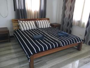 Ένα ή περισσότερα κρεβάτια σε δωμάτιο στο Vukoyoyo Hills Beach Resort