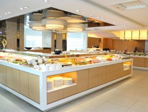a buffet line in a restaurant with food at Maison de Chine Taichung (Pin Chen) in Taichung