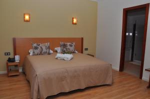 Postel nebo postele na pokoji v ubytování Across Hotels & Spa