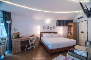 Ένα ή περισσότερα κρεβάτια σε δωμάτιο στο Koh Mak Cococape Resort