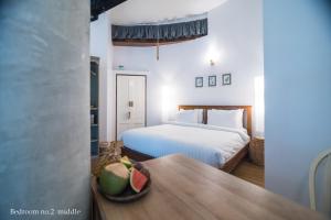 Ένα ή περισσότερα κρεβάτια σε δωμάτιο στο Koh Mak Cococape Resort