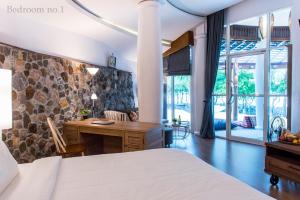 Ένα ή περισσότερα κρεβάτια σε δωμάτιο στο Koh Mak Cococape Resort