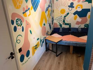 a small room with a bed and a wall at Wontonmeen in Hong Kong
