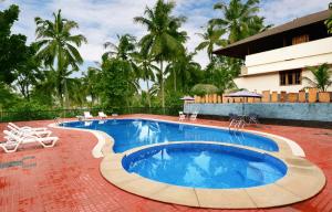 Bazén v ubytování Eco Garden Resort & Heritage Cheruthuruthy Thrissur nebo v jeho okolí