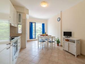 A kitchen or kitchenette at Bright Apartment Near The Beach In Otranto