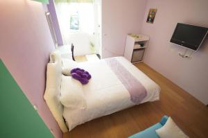 מיטה או מיטות בחדר ב-Hualien Manlu B&B