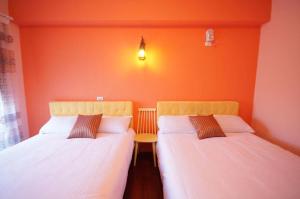 Säng eller sängar i ett rum på Hualien Manlu B&B