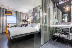 Voodi või voodid majutusasutuse Radisson Blu Riverside Hotel toas
