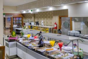 a kitchen with many plates of food on a counter at Sealife Family Resort Hotel in Antalya