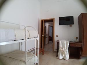 Postel nebo postele na pokoji v ubytování IERRE B&B il piacere dell accoglienza