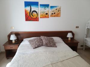 Postel nebo postele na pokoji v ubytování IERRE B&B il piacere dell accoglienza