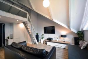 Μια τηλεόραση ή/και κέντρο ψυχαγωγίας στο Apartamenty ZACISZE