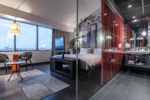 Voodi või voodid majutusasutuse Radisson Blu Riverside Hotel toas
