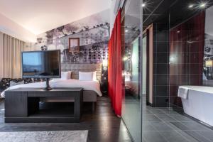 Voodi või voodid majutusasutuse Radisson Blu Riverside Hotel toas