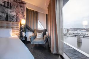 Voodi või voodid majutusasutuse Radisson Blu Riverside Hotel toas