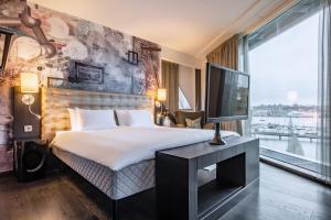 Voodi või voodid majutusasutuse Radisson Blu Riverside Hotel toas