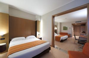 Postel nebo postele na pokoji v ubytování THotel Lamezia