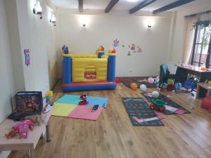 a room with a play room with toys on the floor at Pensiunea Medieval in Predeal