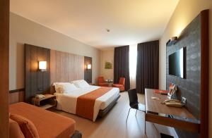 Postel nebo postele na pokoji v ubytování THotel Lamezia