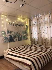 Postel nebo postele na pokoji v ubytování Tourism B&B