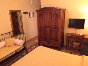 Postel nebo postele na pokoji v ubytování Hotel Il Caminetto