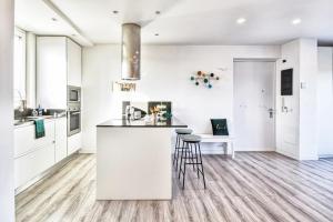 A kitchen or kitchenette at St. Peter penthouse