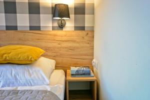 Posteľ alebo postele v izbe v ubytovaní Apartamenty Magia Gór