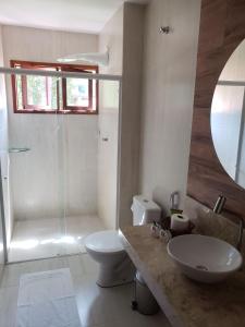a bathroom with a sink and a toilet and a shower at RANCHO GOSTOSO POUSADA in São Miguel do Gostoso +21 photos