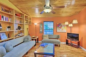 a living room with a couch and a ceiling fan at Mount Dora Townhome in Historical District! in Mount Dora