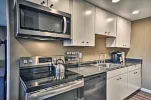 a kitchen with stainless steel appliances and a microwave at Estacada Home - Near Milo McIver State Park! in Estacada