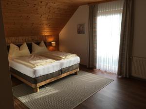 Postel nebo postele na pokoji v ubytování Gerstbreinhof