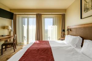 Cama ou camas em um quarto em Best Western Vilnius