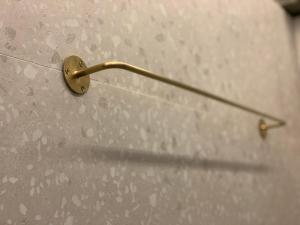 a metal object is attached to a wall at Wontonmeen in Hong Kong