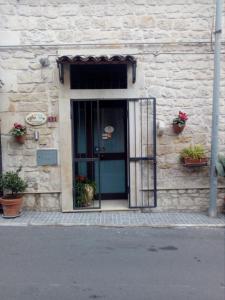 an entrance to a building with a glass door at B&B Trinacria Modica in Modica
