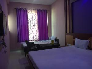 Hotel Shree Hari客房内的一张或多张床位