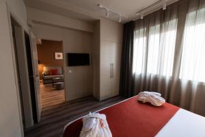 Posteľ alebo postele v izbe v ubytovaní Atenea Rekord Suites