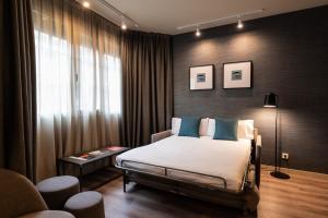 Posteľ alebo postele v izbe v ubytovaní Atenea Rekord Suites