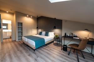 Posteľ alebo postele v izbe v ubytovaní Atenea Rekord Suites