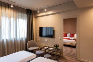 Posteľ alebo postele v izbe v ubytovaní Atenea Rekord Suites