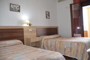 Postel nebo postele na pokoji v ubytování LABELLA - Hostal Rural Restaurante