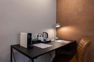 Príslušenstvo na prípravu kávy alebo čaju v ubytovaní Atenea Rekord Suites