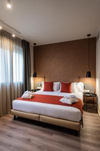 Posteľ alebo postele v izbe v ubytovaní Atenea Rekord Suites